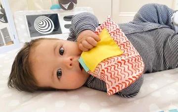 baby with crinkle bag